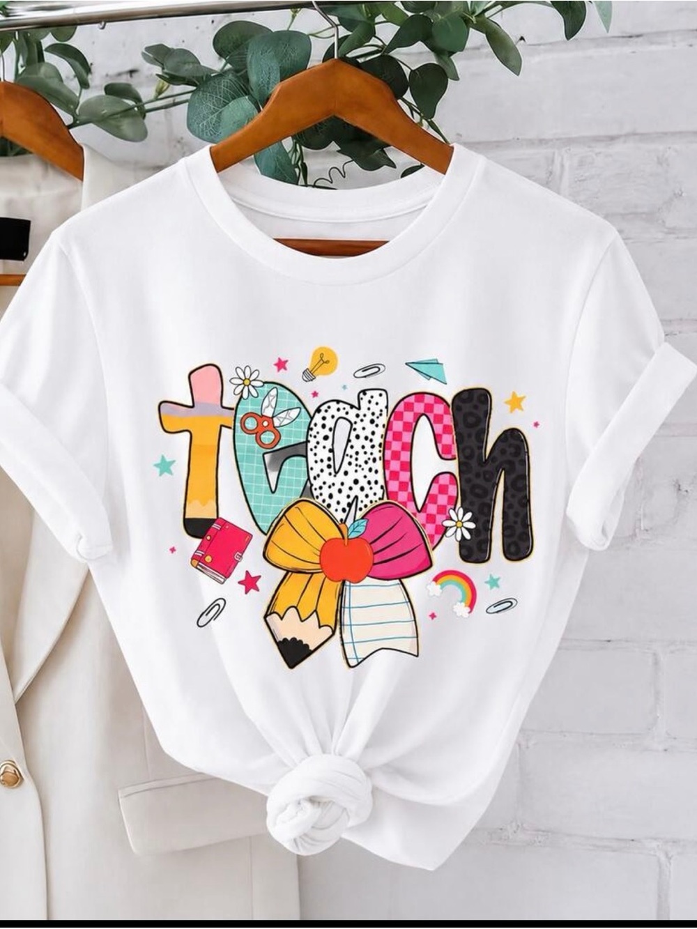 White Graphic Short Sleeve Tee with Colorful 'Teach' Design